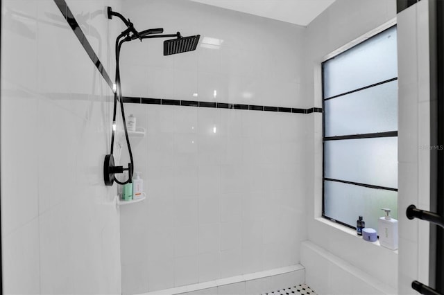 bathroom with a tile shower