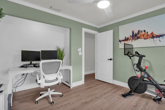 office space with ceiling fan, light wood-type flooring, and ornamental molding