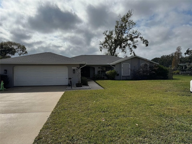 single story home featuring a front yard and a garage