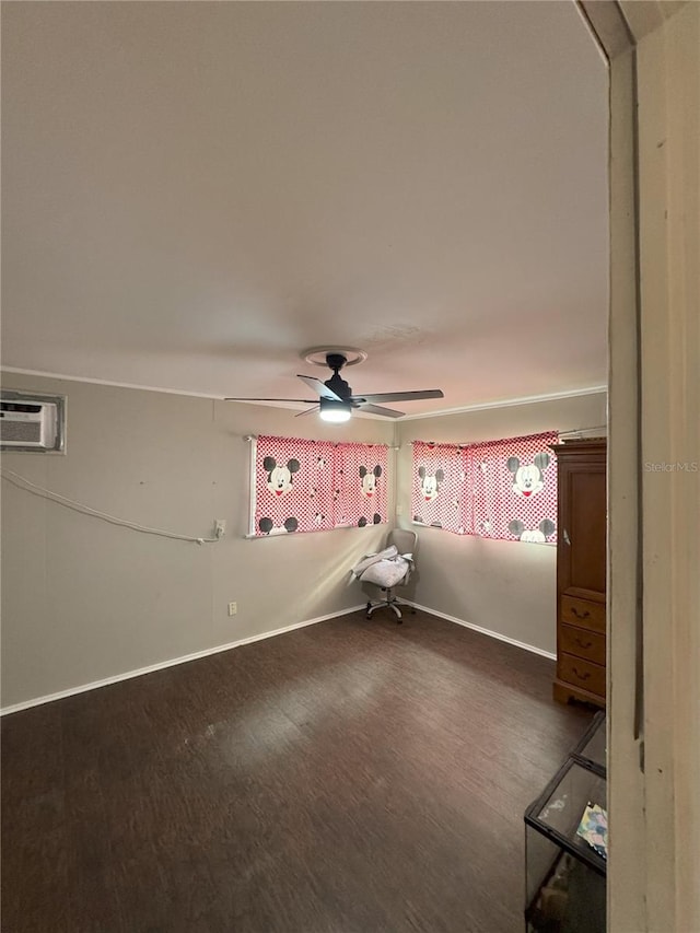 spare room with ceiling fan, a wall mounted AC, and hardwood / wood-style floors