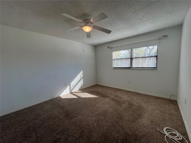 spare room featuring carpet flooring and ceiling fan