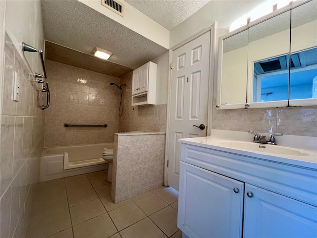 full bathroom featuring backsplash, tile patterned floors, vanity, toilet, and tiled shower / bath