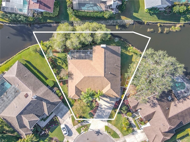 birds eye view of property with a water view