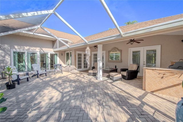 back of property featuring french doors, ceiling fan, an outdoor living space, and a patio area