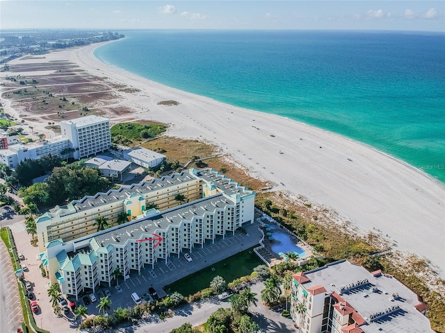 birds eye view of property with a view of the beach and a water view