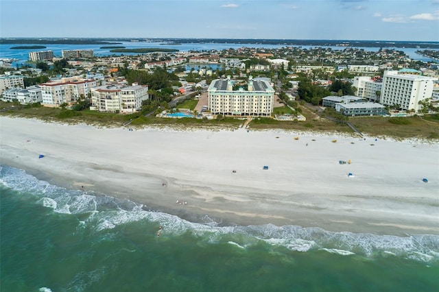 birds eye view of property featuring a view of the beach and a water view