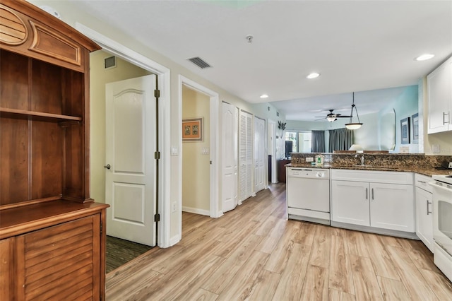 kitchen with white dishwasher, ceiling fan, light hardwood / wood-style floors, and white cabinetry