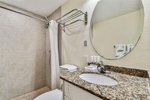 bathroom featuring a shower with shower curtain, vanity, and toilet