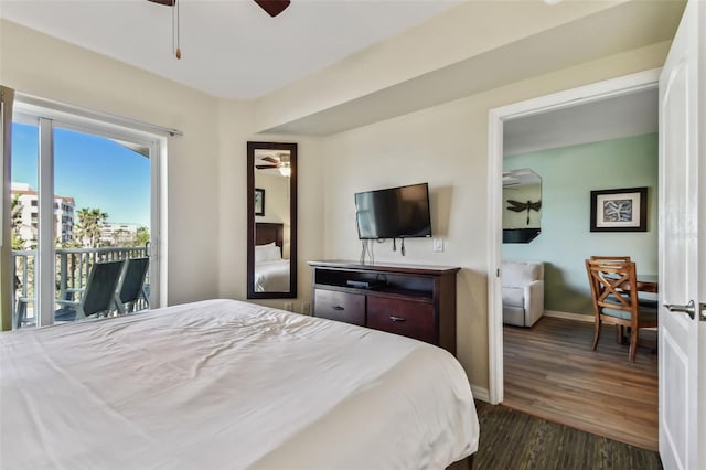 bedroom with access to exterior, ceiling fan, and dark hardwood / wood-style floors