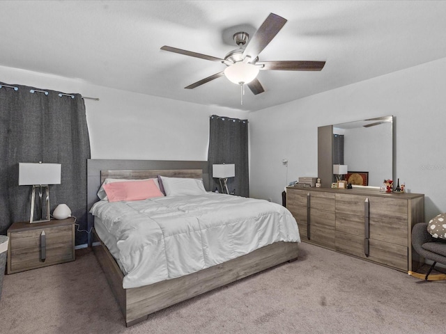 bedroom featuring light carpet and ceiling fan