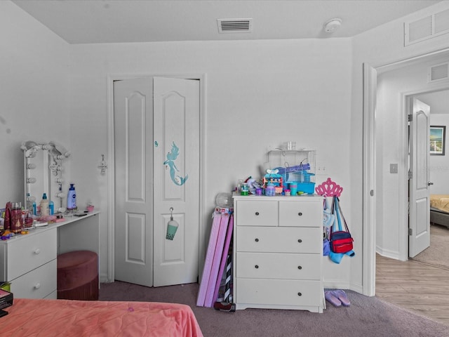 bedroom with carpet and a closet