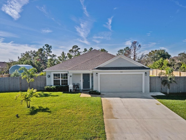 ranch-style home featuring a garage and a front lawn