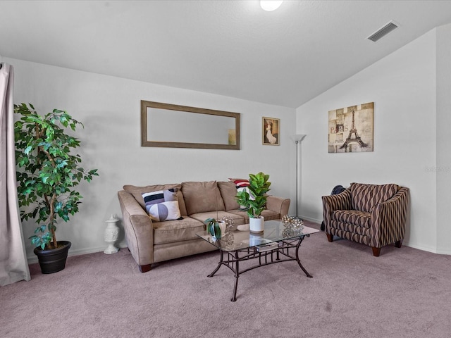 carpeted living room with vaulted ceiling