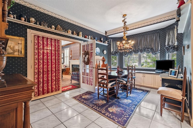 tiled dining room featuring a textured ceiling and an inviting chandelier