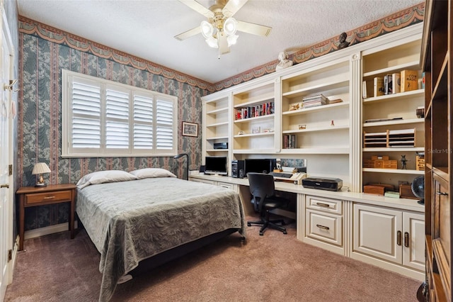 bedroom with carpet, ceiling fan, and a textured ceiling