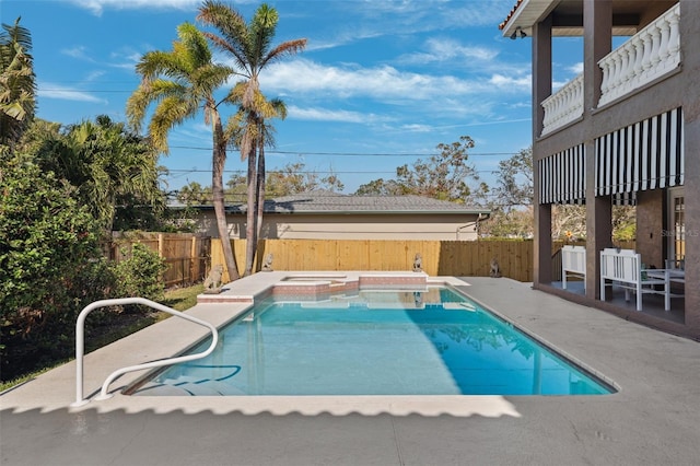 view of pool featuring an in ground hot tub and a patio