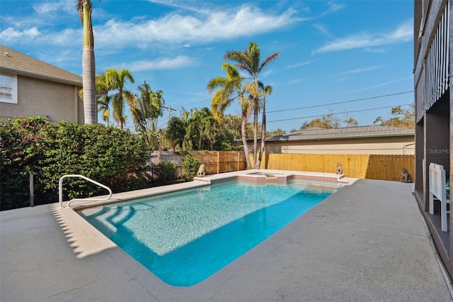 view of pool with a patio area and a jacuzzi