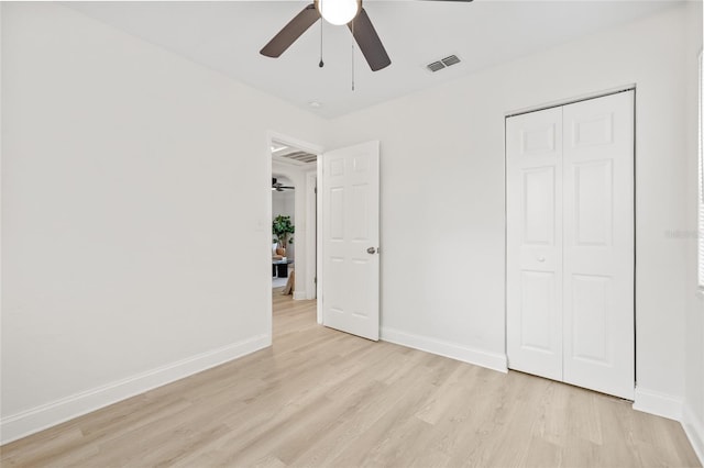 unfurnished bedroom featuring a closet, ceiling fan, and light hardwood / wood-style floors