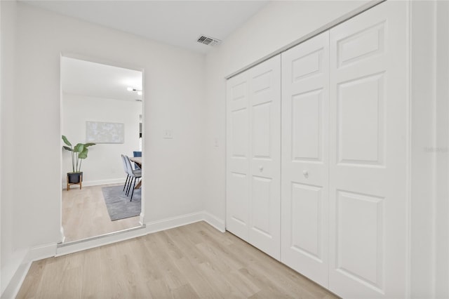 corridor featuring light hardwood / wood-style floors