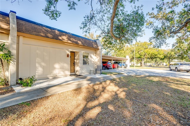 view of front of home featuring a carport