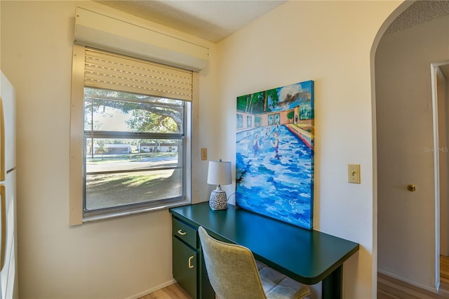 office with hardwood / wood-style flooring