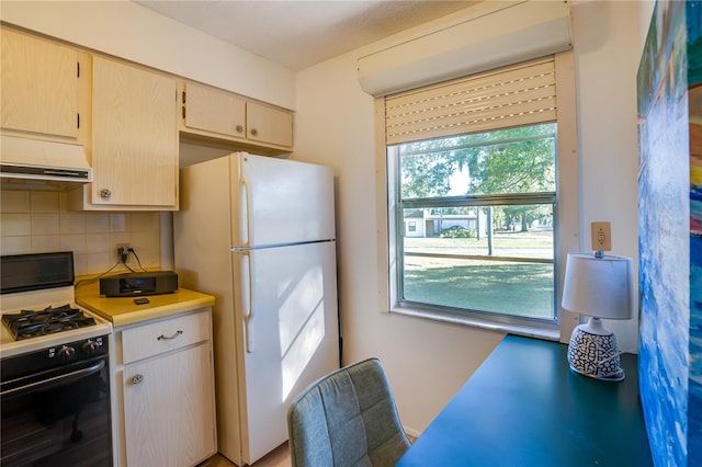 kitchen with decorative backsplash, white appliances, ventilation hood, and a wealth of natural light