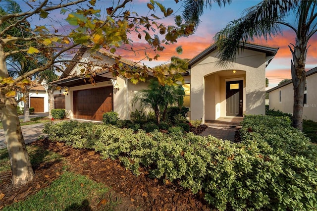 mediterranean / spanish-style house featuring a garage