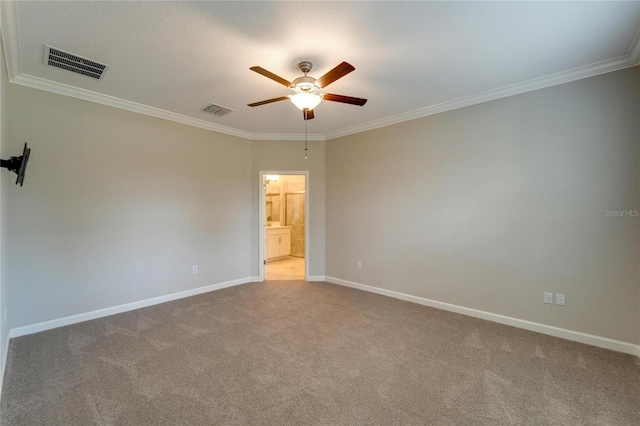 spare room with carpet flooring, ceiling fan, and ornamental molding