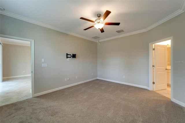 tiled empty room featuring ceiling fan and ornamental molding