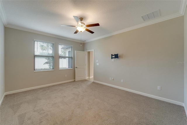 unfurnished room with light carpet, ceiling fan, and crown molding