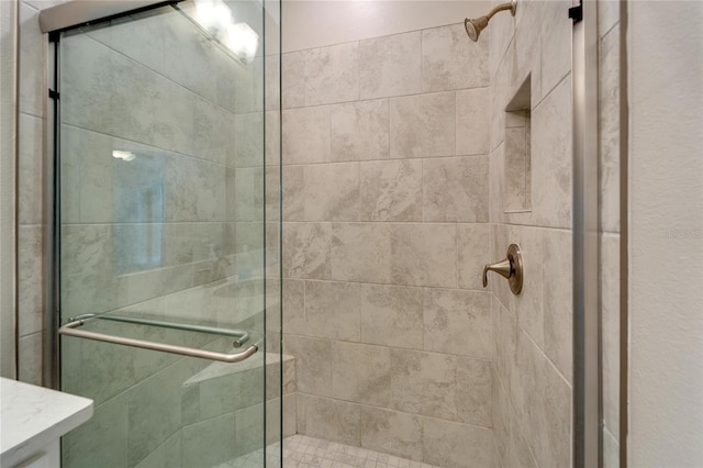 bathroom featuring vanity and walk in shower