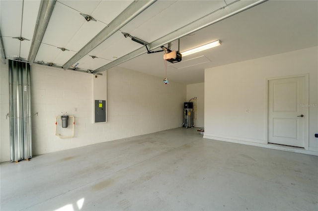 garage with a garage door opener and heat pump water heater