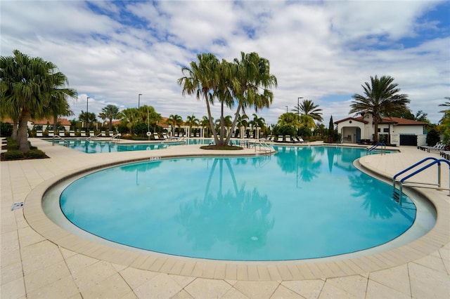 view of swimming pool featuring a patio