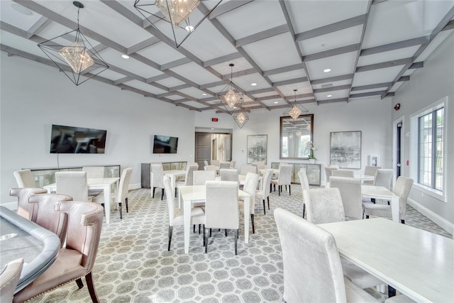 dining space with beamed ceiling and coffered ceiling