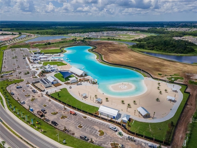 birds eye view of property with a water view