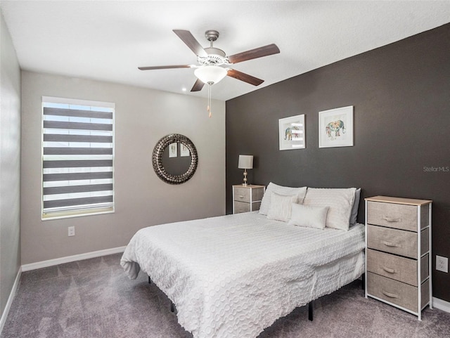 bedroom featuring ceiling fan and dark colored carpet