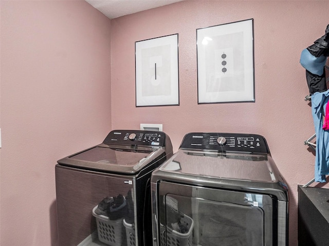 laundry room with independent washer and dryer