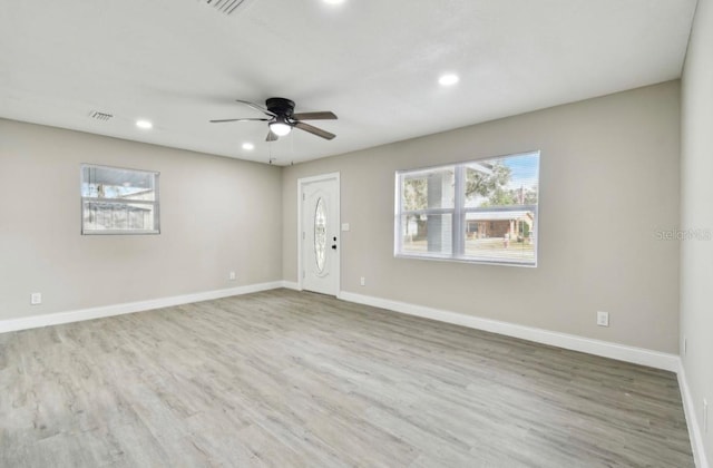 interior space with ceiling fan and hardwood / wood-style flooring