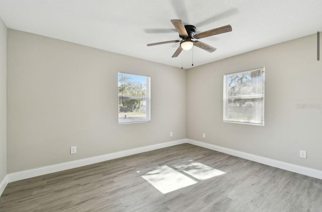 unfurnished room featuring hardwood / wood-style flooring and ceiling fan