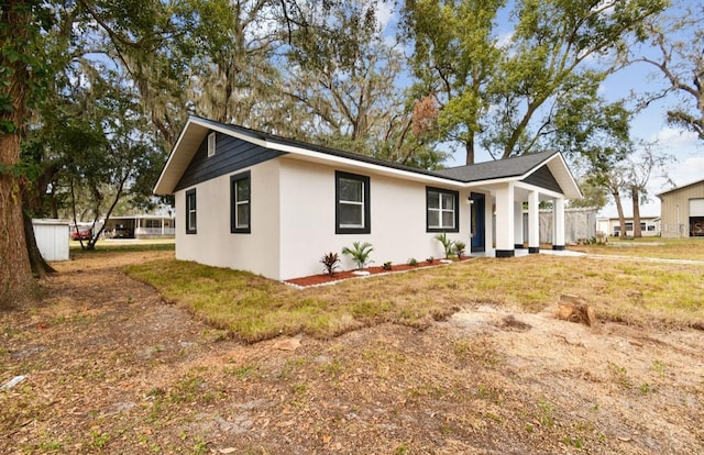 ranch-style house with a front lawn