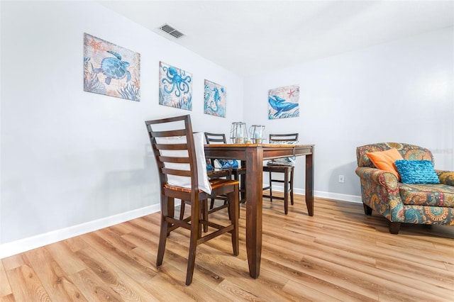 dining room with light hardwood / wood-style floors