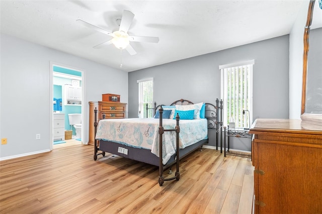 bedroom with light hardwood / wood-style flooring, ceiling fan, and ensuite bathroom