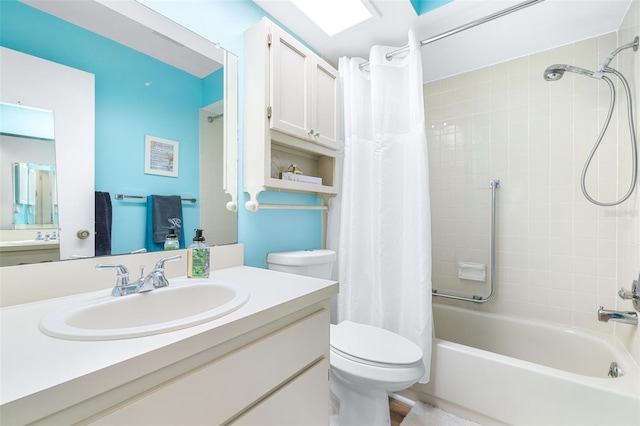 full bathroom with vanity, shower / tub combo with curtain, and toilet