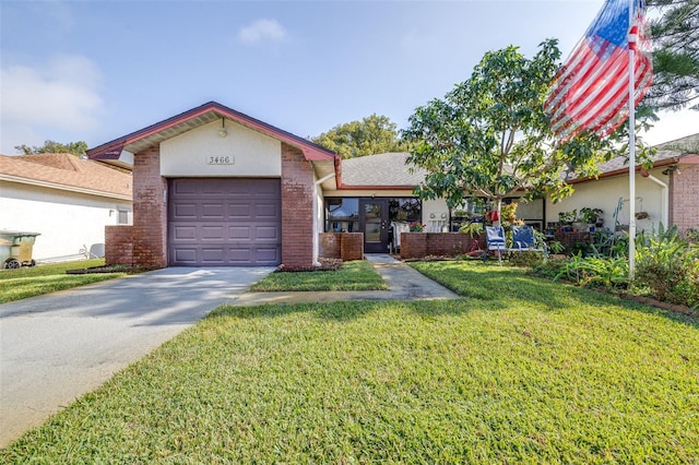 ranch-style home featuring a garage, concrete driveway, a front lawn, and brick siding