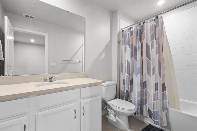 full bathroom featuring toilet, tile patterned floors, shower / tub combo with curtain, and vanity