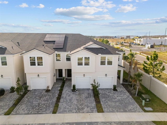 view of front of house featuring solar panels