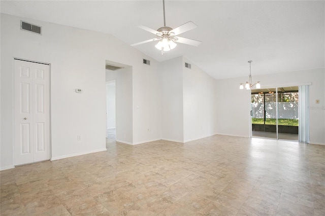 empty room featuring ceiling fan with notable chandelier and vaulted ceiling