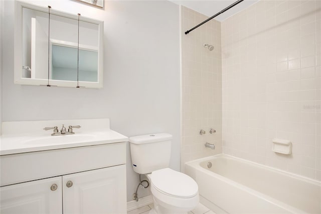 full bathroom with tiled shower / bath, vanity, toilet, and tile patterned floors