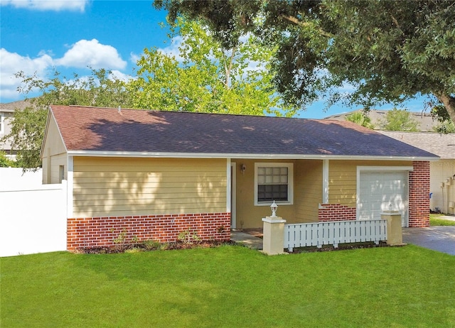 ranch-style house with a garage and a front yard