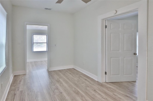 empty room featuring ceiling fan and light wood-type flooring